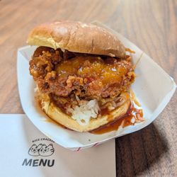 Rice cracker pop-up: spicy chicken sandwich: fried thigh, pickled daikon, gochujang butter, potato bun