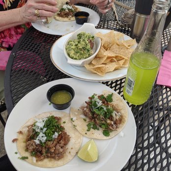 Taco Shop - Carnitas tacos and guacamole with chips. - Tacos Near Me - Reno, Nevada