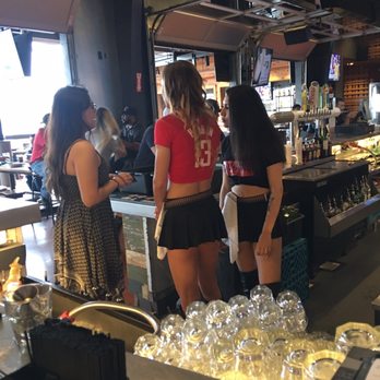 Bombshells Restaurant & Bar - Bar tender huddle...great professional and fun service! - Sports Bars Near Me - Pearland, Texas Bombshells Restaurant & Bar - Bar tender huddle...great professional and fun service! - Sports Bars Near Me - Pearland, Texas