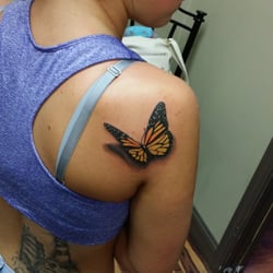 New Addiction Tattoo - Realistic butterfly sitting on her shoulder