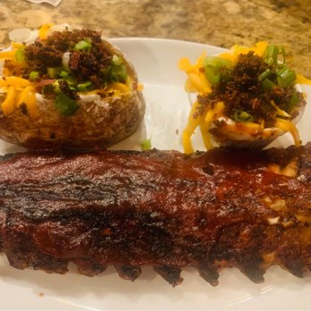 Ruckerjohns A Restaurant & More - Ribs with loaded baked potato, extra loading too..... - American Near Me - Wilmington, North Carolina Ruckerjohns A Restaurant & More - Ribs with loaded baked potato, extra loading too..... - American Near Me - Wilmington, North Carolina