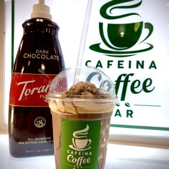 Cafeina Coffee Bar - a cup of coffee and a bottle of coffee - Coffee & Tea Near Me - Margate, Florida