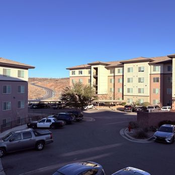 Red Rock at Sienna Hills - Buildings across the parking lot - Apartments Near Me - Washington, Utah Red Rock at Sienna Hills - Buildings across the parking lot - Apartments Near Me - Washington, Utah
