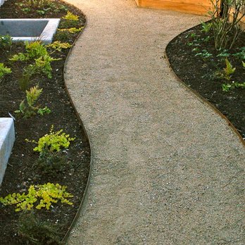 MGG landscaping - a walkway in front of a house - Landscaping Near Me