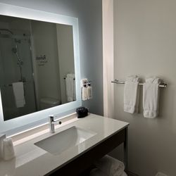 EVEN Hotel Atlanta - Cobb Galleria - Clean - BUT sink sloped to back so any water splashed or spilled pooled behind faucets.