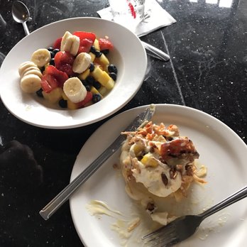 Slappy Cakes - Portuguese sausage eggs Benedict and fruit bowl. YUM - Breakfast & Brunch Near Me - Lahaina, Hawaii Slappy Cakes - Portuguese sausage eggs Benedict and fruit bowl. YUM - Breakfast & Brunch Near Me - Lahaina, Hawaii