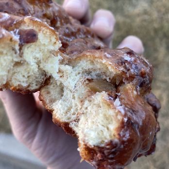 Bearscat Bakehouse - a hand holding a half eaten donut - Bakeries Near Me - Bismarck, North Dakota Bearscat Bakehouse - a hand holding a half eaten donut - Bakeries Near Me - Bismarck, North Dakota