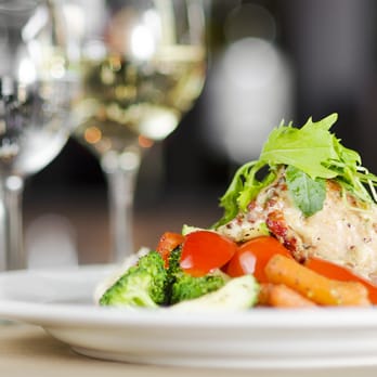 Fellini Koolini's - a plate of food and wine glasses - Italian Near Me - London, Ontario
