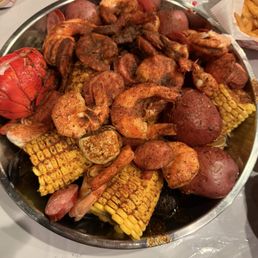 Cajun boil (hot) with shrimp, lobster tail, mussels, clams, corn, and potatoes Cajun boil (hot) with shrimp, lobster tail, mussels, clams, corn, and potatoes