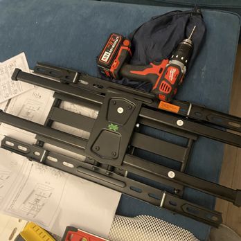 Eagle Precision TV Mounting  - TV mounting bracket and power drill, stud finder, and level, ready to be installed. - TV Mounting Near Me