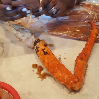 Claws Restaurant - Claws King crab legs with unknown black substance on them (pic 1) - Cajun/Creole Near Me - Cerritos, California