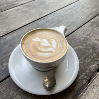 Houndstooth Coffee - a cup of cappuccino on a saucer - Coffee & Tea Near Me - Austin, Texas
