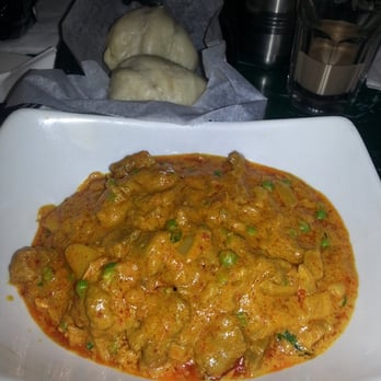 Cafe Tibet - lamb curry.  The bread is similar to the steamed pork bun bread. - Himalayan/Nepalese Near Me - Brooklyn, New York