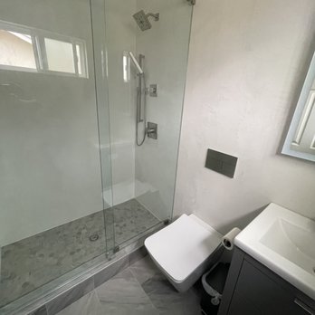Z Plus Construction - a bathroom with a shower and toilet - General Contractors Near Me