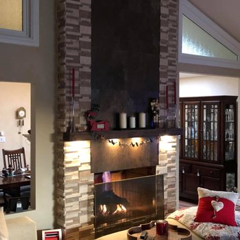 Appease Builders - Re-framing of a fireplace and complete face lift. Stone, tile, custom made mantel with custom lighting - Plumbing Near Me - Long Beach, California Appease Builders - Re-framing of a fireplace and complete face lift. Stone, tile, custom made mantel with custom lighting - Plumbing Near Me - Long Beach, California