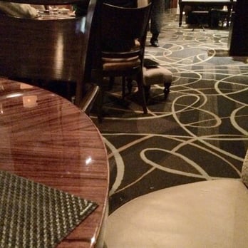 The Blvd - They have this lady a foot rest for her purse. LoL. How sweet and cute I may add. - New American Near Me - Beverly Hills, California