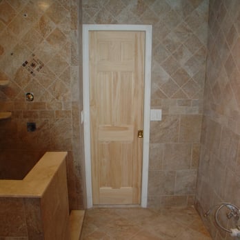 Master Baths and Tile - a bathroom with a wooden door - General Contractors Near Me - Havelock, North Carolina Master Baths and Tile - a bathroom with a wooden door - General Contractors Near Me - Havelock, North Carolina