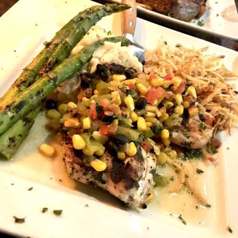 Verf's Grill & Tavern - Verf's chicken garnished with hatch chiles, roasted corn, black beans and cilantro, and served with mashed potatoes and grilled asparagus. - Bars Near Me - Flower Mound, Texas Verf's Grill & Tavern - Verf's chicken garnished with hatch chiles, roasted corn, black beans and cilantro, and served with mashed potatoes and grilled asparagus. - Bars Near Me - Flower Mound, Texas