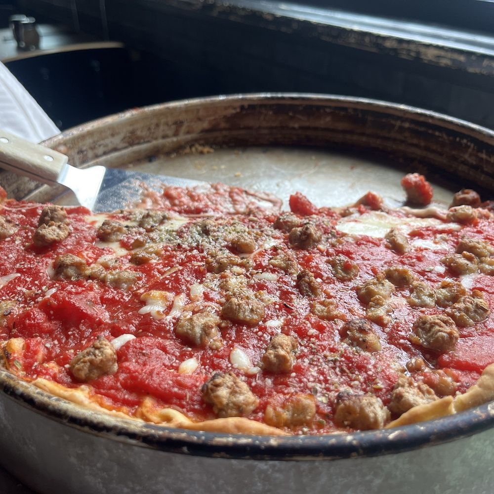 "Chicago Style Deep Dish" with a curious side of "we don't know how to do half toppings despite we layered them above the sauce." "Chicago Style Deep Dish" with a curious side of "we don't know how to do half toppings despite we layered them above the sauce."