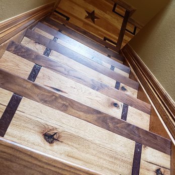 Twisted Oak Flooring Specialists - a close up of a wooden staircase - Flooring Near Me