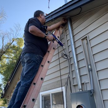 Electric Company - Ed plata weatherproofing the top of the riser where it meets the house. - Electricians Near Me