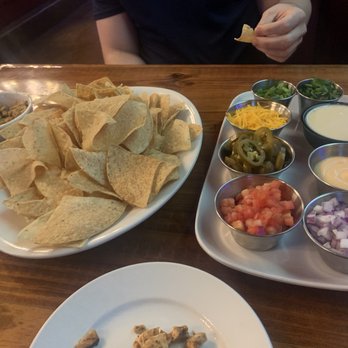 The District Tap - TDT Nachos-Chicken Chips on the side - Sports Bars Near Me - Indianapolis, Indiana