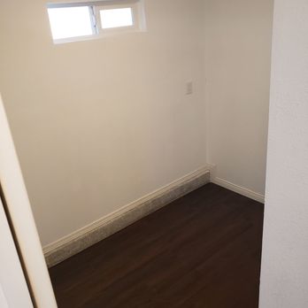 Madrigal Construction - an empty room with a window - General Contractors Near Me