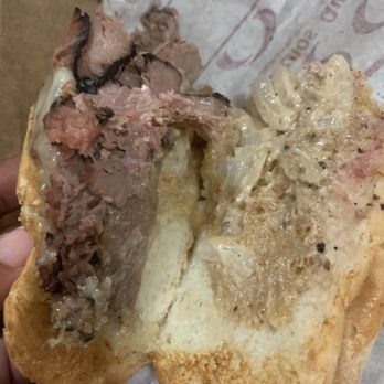 Quiznos - a hand holding a half eaten sandwich - Sandwiches Near Me - Torrance, California Quiznos - a hand holding a half eaten sandwich - Sandwiches Near Me - Torrance, California