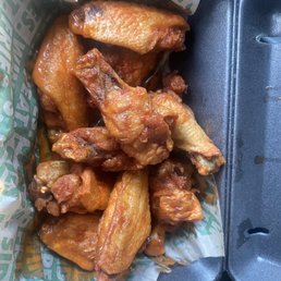 a container of chicken wings