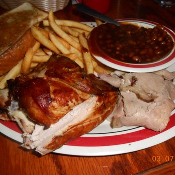 Rib City - North Cape Coral BBQ - a plate of food including a roast turkey, french fries, and baked beans - Barbeque Near Me - Cape Coral, Florida Rib City - North Cape Coral BBQ - a plate of food including a roast turkey, french fries, and baked beans - Barbeque Near Me - Cape Coral, Florida