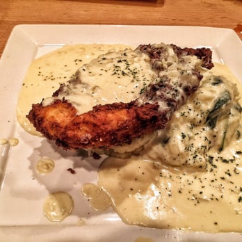 Danielle's Scratch Kitchen - Chicken fried chicken on a bed of mashed potatoes with bourbon gravy. - Seafood Near Me - Castle Rock, Colorado Danielle's Scratch Kitchen - Chicken fried chicken on a bed of mashed potatoes with bourbon gravy. - Seafood Near Me - Castle Rock, Colorado