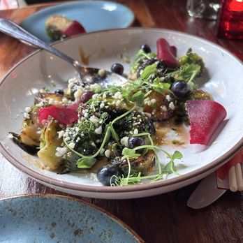 Brighton Bodega - Roasted brussel sprouts with shaved beets, grapes and blueberries - Cocktail Bars Near Me - Brighton, Massachusetts