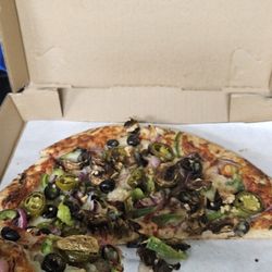 Veggie pizza so good I forgot to take a picture before I are half. :) A+++