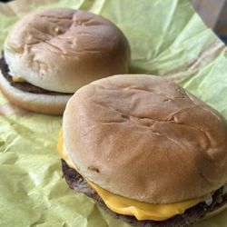 Lunch to go - Cheeseburger, no ketchup, extra pickles.