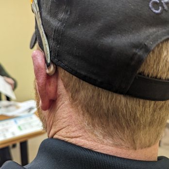 Miracle-Ear Center - Looking at how the beige hearing aids look from the back of his head left side - Hearing Aid Providers Near Me - Grandville, Michigan