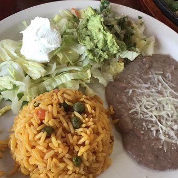Alejandro's Mexican Restaurant - Rice & beans, lettuce, guacamole, green salsa that came with the fajita meat - Mexican Near Me - Brooksville, Florida
