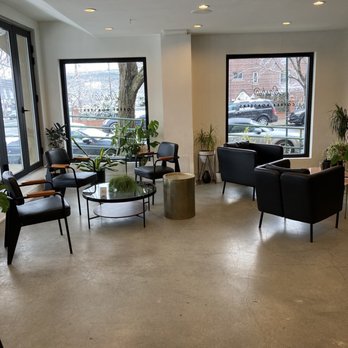 Kinship Coffee - a view of a coffeehouse with a coffee table and chairs - Coffee & Tea Near Me - Astoria, New York Kinship Coffee - a view of a coffeehouse with a coffee table and chairs - Coffee & Tea Near Me - Astoria, New York