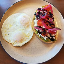 Avocado toast with 2 eggs over medium.