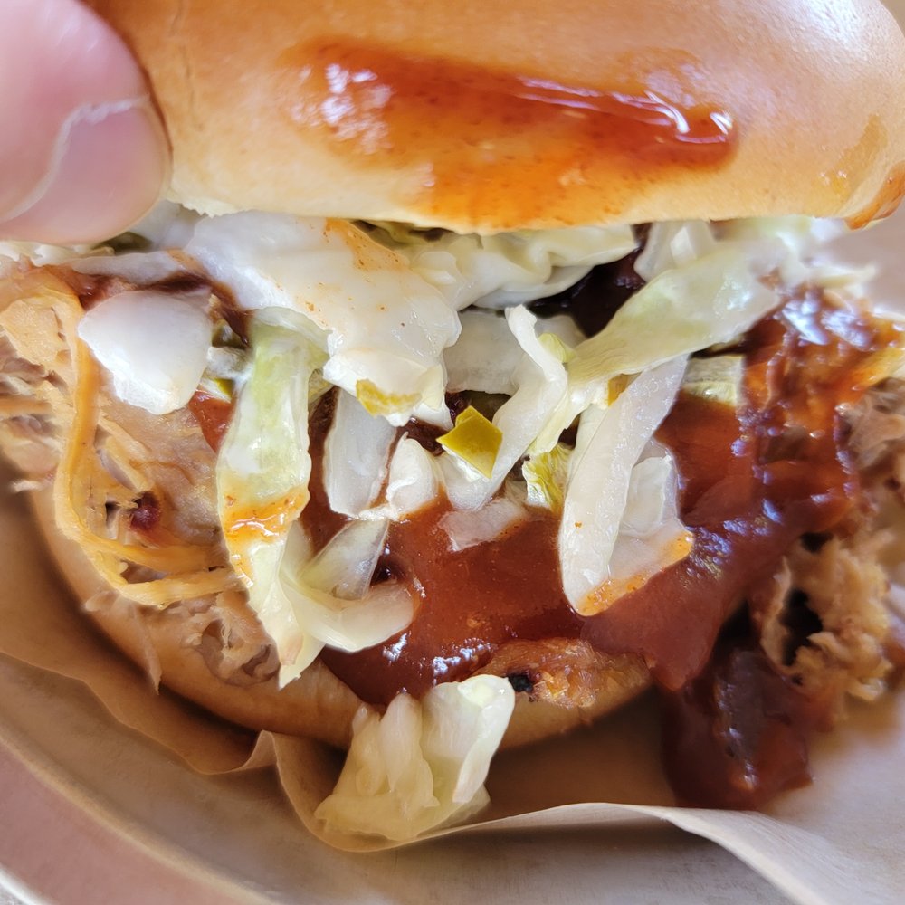 The Empty Pint - Pulled Pork Sandwich - Plenty of jalapeño slaw on top! - Brewpubs Near Me - Lakewood, New York The Empty Pint - Pulled Pork Sandwich - Plenty of jalapeño slaw on top! - Brewpubs Near Me - Lakewood, New York