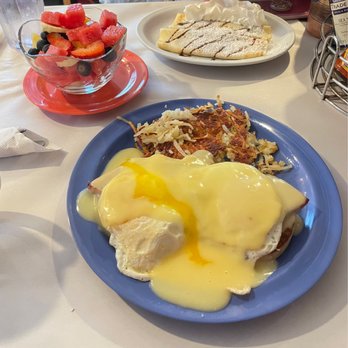 Java Joe's Cafe - Eggs Benedict, small fruit cup and a short stack of Nutella Crepes. Yummy!! - Breakfast & Brunch Near Me - Saint Ignace, Michigan