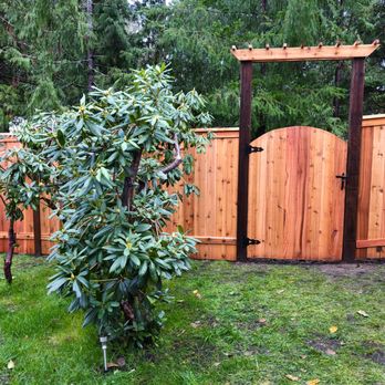 Summit Fence Company - Curved gate with arbor and cool black hardware - Fences & Gates Near Me - Lacey, Washington Summit Fence Company - Curved gate with arbor and cool black hardware - Fences & Gates Near Me - Lacey, Washington