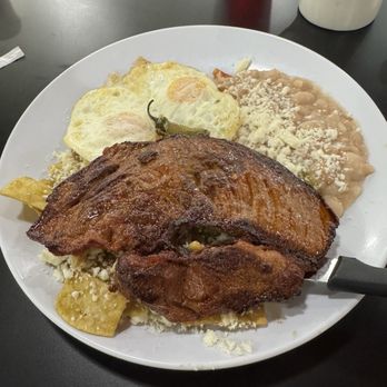 Huevos Avenue - Chilaquiles con Huevos with no sour cream and added carne asada - Mexican Near Me - Henderson, Nevada Huevos Avenue - Chilaquiles con Huevos with no sour cream and added carne asada - Mexican Near Me - Henderson, Nevada