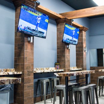 Shot Republic - a row of bar stools in a restaurant - Sports Bars Near Me - Brownsville, Texas Shot Republic - a row of bar stools in a restaurant - Sports Bars Near Me - Brownsville, Texas
