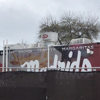 Chris Madrid's - Food trucks & eating area other side of fence near parking lot. - Burgers Near Me - San Antonio, Texas Chris Madrid's - Food trucks & eating area other side of fence near parking lot. - Burgers Near Me - San Antonio, Texas