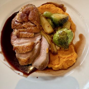 American Bounty Restaurant - - ROASTED DUCK BREAST: Spiced Glazed, Sweet Potato Purée, Herb Roasted Brussels Sprouts & Parsnips, Port Gastrique - New American Near Me - Hyde Park, New York