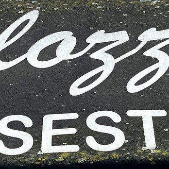 Calozzi's Cheesesteaks - Closeup of sign on awning - Cheesesteaks Near Me - Seattle, Washington
