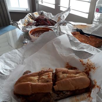 Main Street Grill - Clockwise from bottom: The Pig, baked beans, pork ribs (7), and garlic bread - Barbeque Near Me - Cambria, California Main Street Grill - Clockwise from bottom: The Pig, baked beans, pork ribs (7), and garlic bread - Barbeque Near Me - Cambria, California
