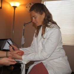 Acupuncture Associates of Castle Rock - Rebecca Wilson L.Ac. using computer analysis to give a new patient an idea of her health picture and how acupuncture can help her.