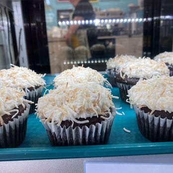 Milk & Cookies Bakeshop - chocolate cupcakes topped with coconut flakes - Desserts Near Me - Edmonton, Alberta Milk & Cookies Bakeshop - chocolate cupcakes topped with coconut flakes - Desserts Near Me - Edmonton, Alberta