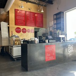 The front order counter with menu above.